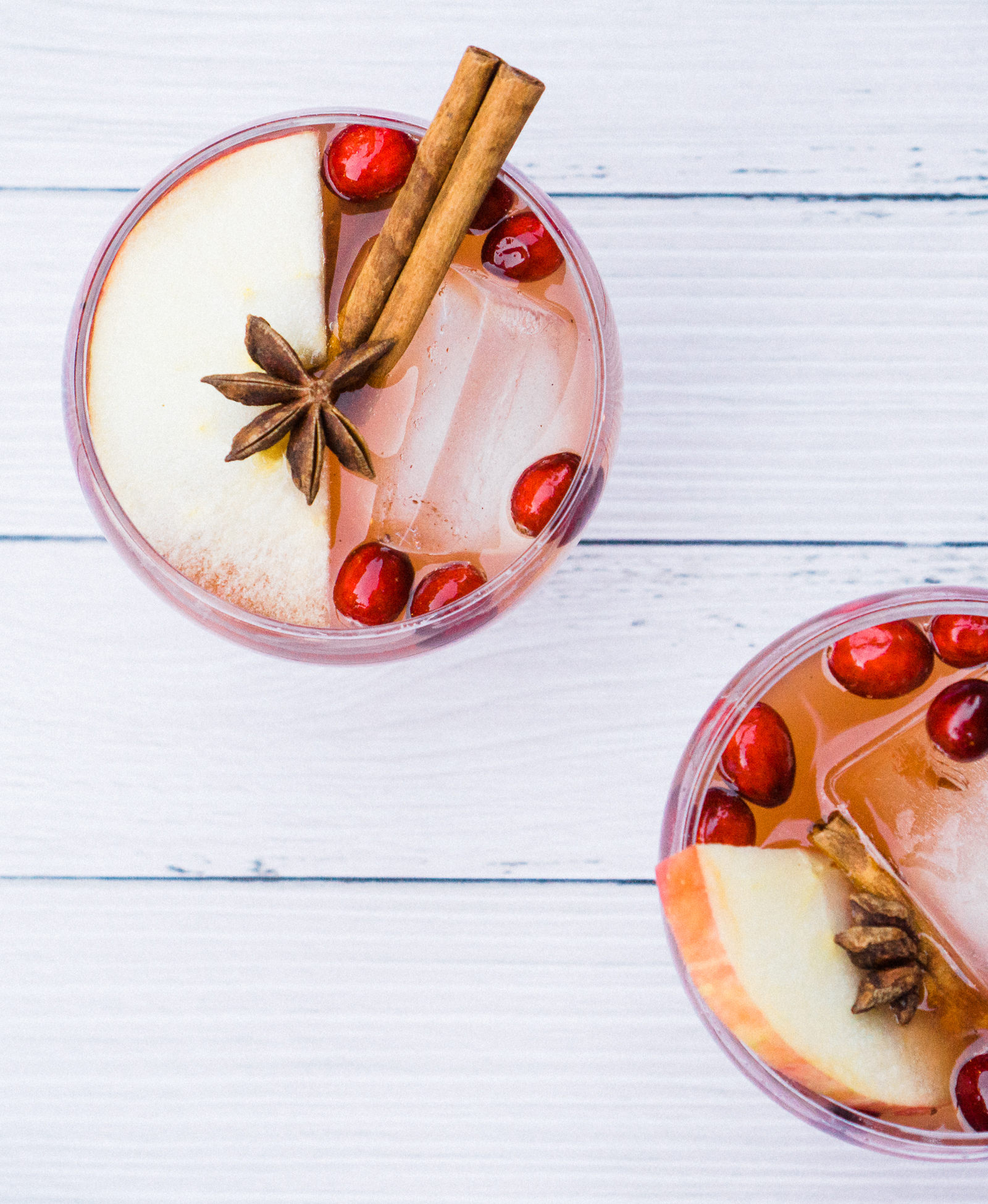 two glasses of Holiday Mocktail: Sparkling Vanilla Ginger Apple Cider Holiday Punch